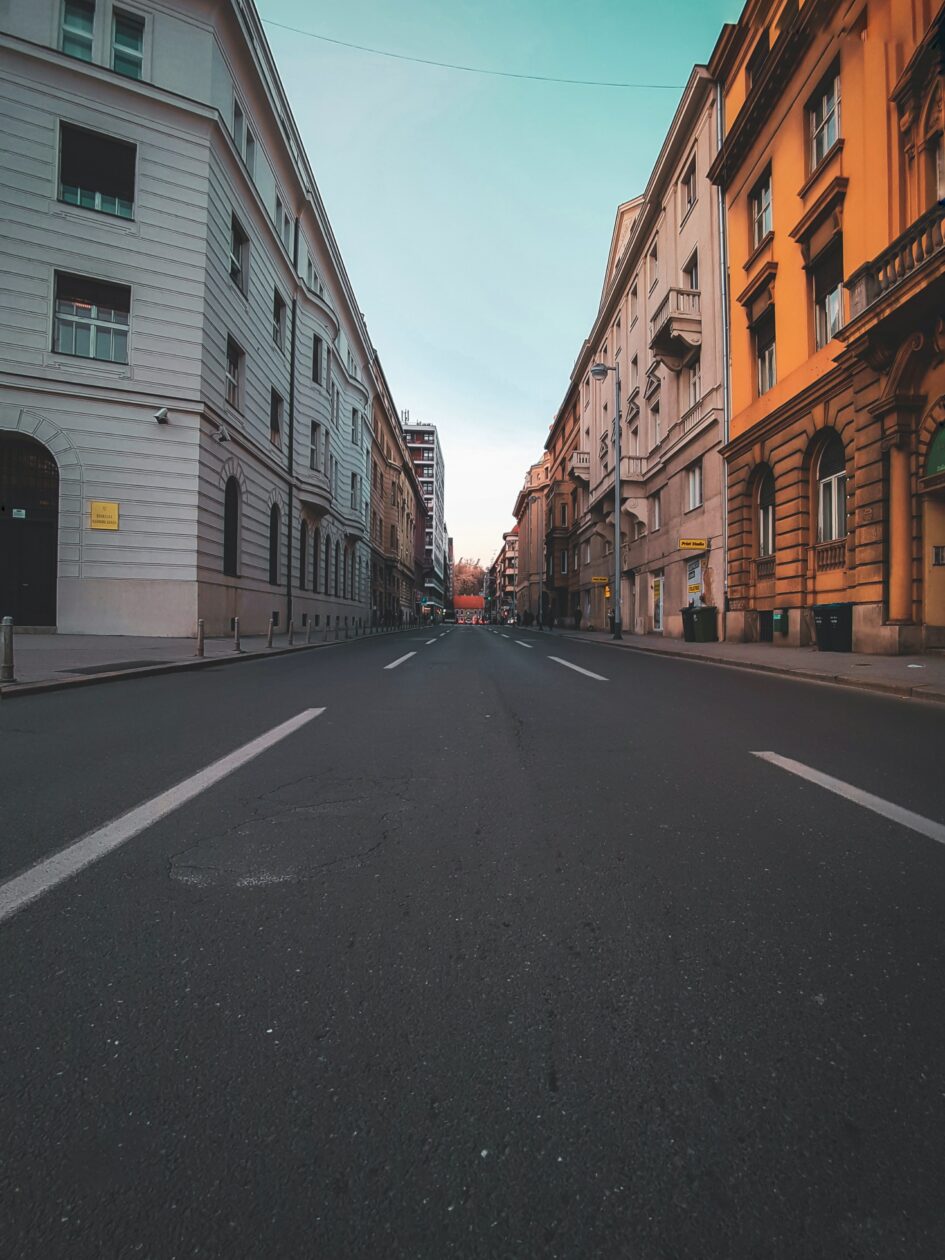 Empty street surrounded by buildings